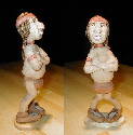 A little over 7 inches tall, he is carved from basswood and lightly painted. He is a little shy about his urge. April 2002.