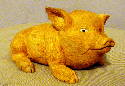 Oct 2003 This little guy is 4.5 inches long, carved from basswood and colored with acrylic paint.