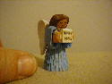 October, 2003 - This was just carved as a filler at one of my carving meetings. The little angel is about 2 inches tall, made from Basswood and painted with acrylics.(That's my thumb beside the angel).