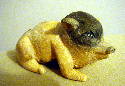 Nov 2003 This little guy is 4.5 inches long, carved from basswood and colored with acrylic paint.