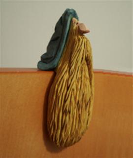 Mar. 2006 - This little guy was inspired by a picture I saw in a carving magazine. He is cut from a block of basswood that measures 2" x 2" x 6" and painted with acrylics.