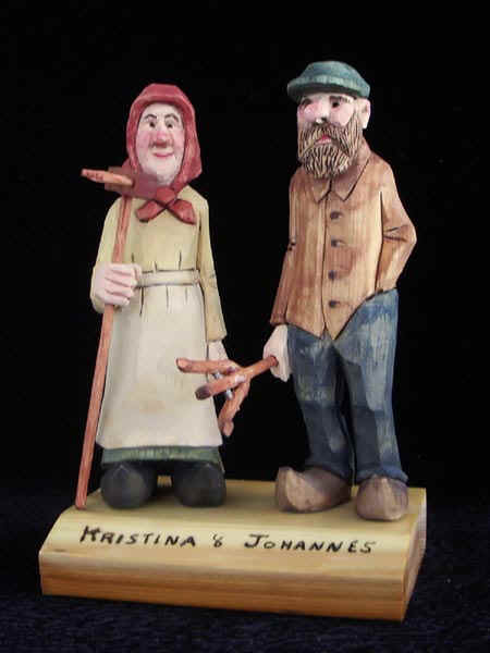 June 2006 - Because of their economic plight, Kristina and Johannes were not able to immigrate to North America. Their situation improved slightly because so many left their native Scandinavia. Johannes bought a rake for his wife but could not afford to buy a fork so he made one out of wood. Carved from basswood, they stand about 6 inches tall. This is the second set I've carved.
