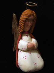 August 2006 - This is the fifth piece of the 15 piece nativity scene. The kneeling angel is carved from basswood, finished with acrylics and stands about 5 1/2 inches tall.