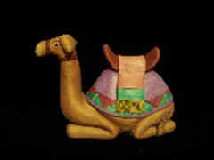 September 2006 - This is the nineth piece of the 15 piece nativity scene. The camel is carved from basswood, finished with acrylics and stands about 5 inches tall and 7 inches long.