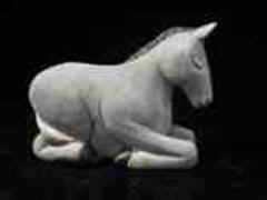 November 2006 - This is the thirteenth piece of the 15 piece nativity scene. The donkey is carved from basswood, finished with acrylics and is about3 inches tall and 5 inches long.