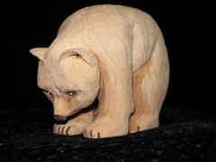 Jan 07 - This little bear can stand on his front feet with his nose on the ground and when given a little nudge, rolls forward until he lands on his feet. Carved from basswood, painted with acrylic, protected with floor wax, he stands about 4 1/2 inches tall.
