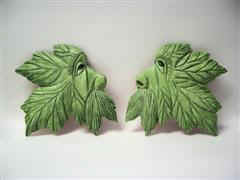 May 2007 - I saw this in one of my carving magazines and like it so I made two. They are about 5 inches high and 4 inches wide and carved from basswood, painted with acrylics and finished with floor wax.