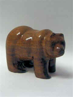 May 2007 - This is a small stylized bear made from a piece of walnut I didn't know what else to do with. He measures about 3 inches long and 2 inches tall.