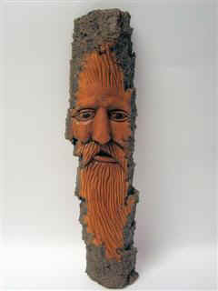 May 2007 - This Wood Spirit is carved from Poplar Bark and he is about 12 inches tall and 2.5 inches wide. Finished with laquer he looks pretty good.