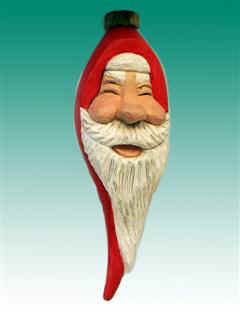 Dec 2009 - This happy little Santa ornament is carved from Basswood and painted with acrylic paint. He measures 7" tall.
