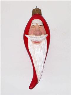 Dec 2009 - This little Santa ornament measures about 6.5" tall and was carved from basswood and finished with acrylic paint.