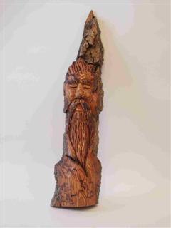 April 2010 - This is carved from poplar bark and measures about 9.5" tall.