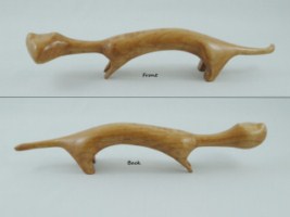 Sept 2011 - This is a small stylized weasel that I carved out of a small piece of hardwood I had kicking around. He measures about 5 inches long and 1 inch tall and is part of a series of small stylized animals I've carved.