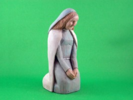 April 2008 - This is the third of a 18 piece Nativity Scene. It is carved from one piece of basswood, painted with acrylics and finished with ordinary paste floor wax. She is about 6 inches tall.