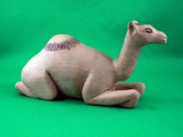 November 2008 - This is the sixth of a 18 piece Nativity Scene. It is carved from one piece of basswood, painted with acrylics and finished with ordinary paste floor wax. He is about 3 inches tall and 6.5 inches long.