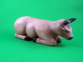 April 2009 - This is the eighth of a 18 piece Nativity Scene. It is carved from one piece of basswood, painted with acrylics and finished with ordinary paste floor wax. He is about 3 inches tall and 7.5 inches long.