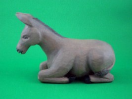June 2009 - This is the nineth of a 18 piece Nativity Scene. It is carved from one piece of basswood, painted with acrylics and finished with ordinary paste floor wax. He is about 3 inches tall and 5 inches long.