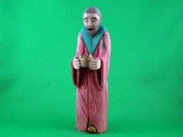 June 2010 - This is the thirteenth of a 18 piece Nativity Scene. It is carved from one piece of basswood, painted with acrylics and finished with ordinary paste floor wax. He is about 8 inches tall.