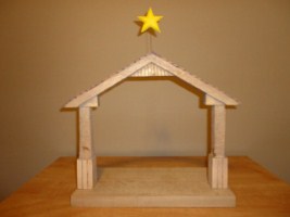 October 2011 - This is the seventeenth of a 18 piece Nativity Scene. It is carved from several pieces of wood, painted with acrylics and finished with ordinary paste floor wax. It is about 13 inches tall and 17 inches wide.