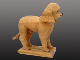November 2011 - I started carving this little guy a couple years ago and for some reason I put it down and never got back to it. I carved it out of a large piece of willow given to me by a friend and my pattern was a picture of my daughter's little French Poodle, Chico who has since passed away so this will be sort of a memorial to Chico who was about 5 years old. The wood was almost the same color as Chico so I didn't have to do much painting but did apply a light wash of acrylic paint and then sealed it with clear carnoba floor wax. He stands about 7.5 inches tall and is about 7.5 inches long.