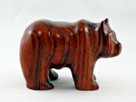 March 2012 -  This stylized grizzly is made from a scrap piece of hardwood I had kicking around.  Not sure what kind of wood but it is very hard and looks very good.  He is about 3 inches long and 2 inches high. 