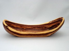 July, 2012 -  This a a hand carved bowl made from caragana wood. It measures 9.5inches long by 3.5 inches wide.