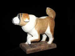 August 2002 - I carved this one from Cottonwood and finished it with acrilyc paints and then with clear floor polish. He is about 6 inches long and 4 inches high.